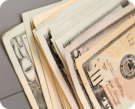 Stack of various US banknotes